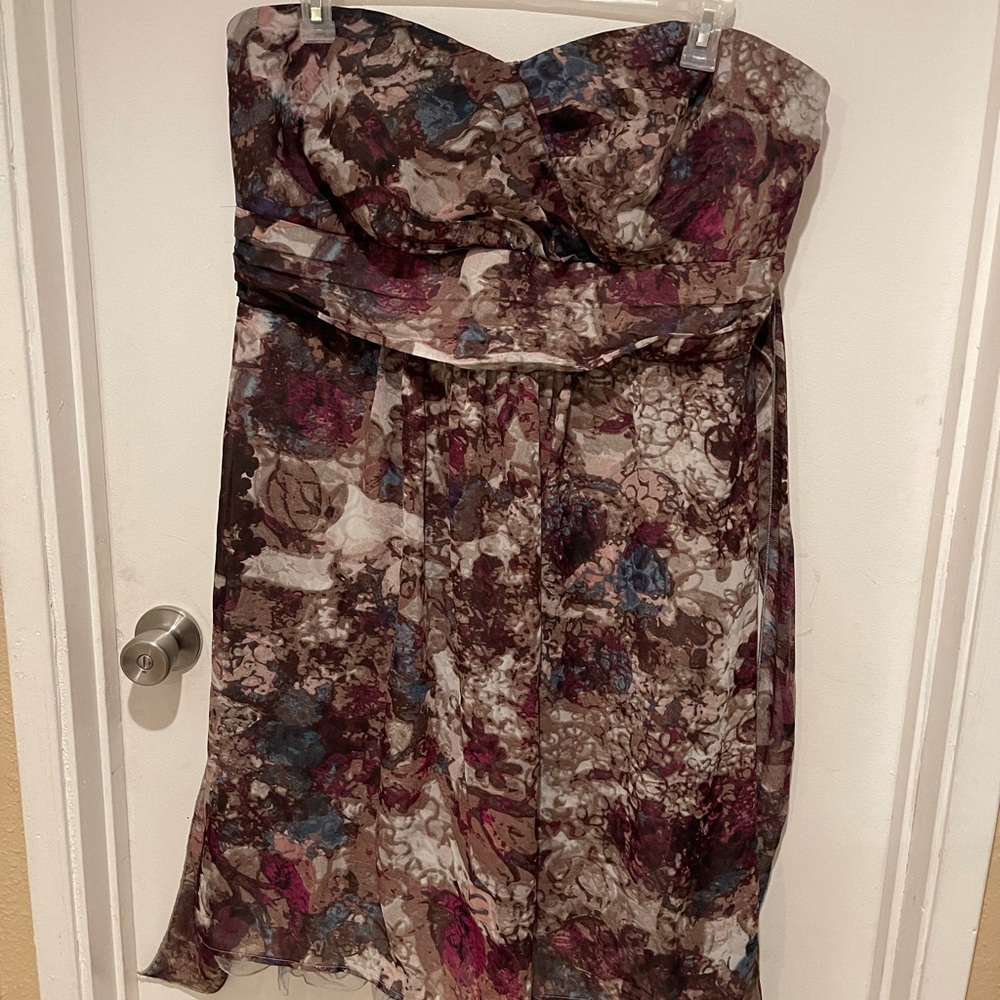 Strapless dress with crinoline lined skirt. Ties in the back.